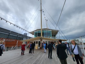 The foredeck of the Britannia. People are standing on it.