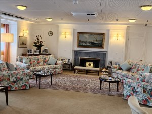 The royal sitting room with soft couches with a loud flower print on them