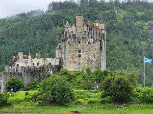 Eilean Donan castle from the mainland, with the Scottish Saltire flag (St. Andrew's blue and white cross) flying