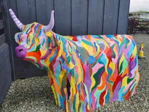 A multi-colored statue of a Heilan Coo