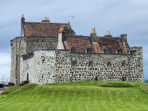 Southern view of Duart castle on a grassy lawn