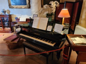 A piano in the Great Hall of Duart Castle, right as you go in