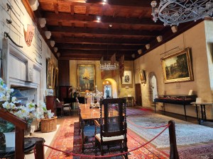 Another view of the Great Hall from the opposite view. In the foreground is the dining table and a chair.
