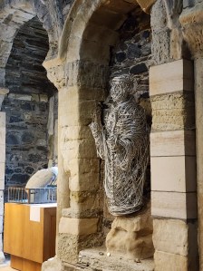 Statue of St. Columba beneath an arch at Iona Abbey