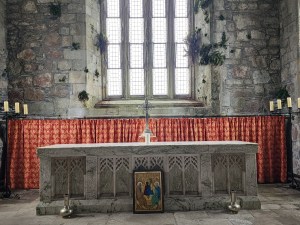 An altar at Iona Abbey, with ivy growing on the walls