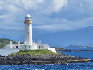 A tall, white lighthouse on the Sound of Mull