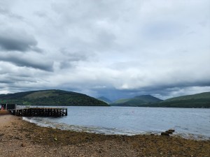 A view of Loch Fyne in the foreground with mountains and sky at the back.