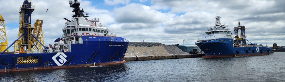 Two large ships docked in Leith harbor