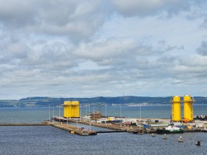 A view of the water with white clouds in the background