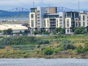 View of apartments in Leith, with the red Forth Bridge in the background